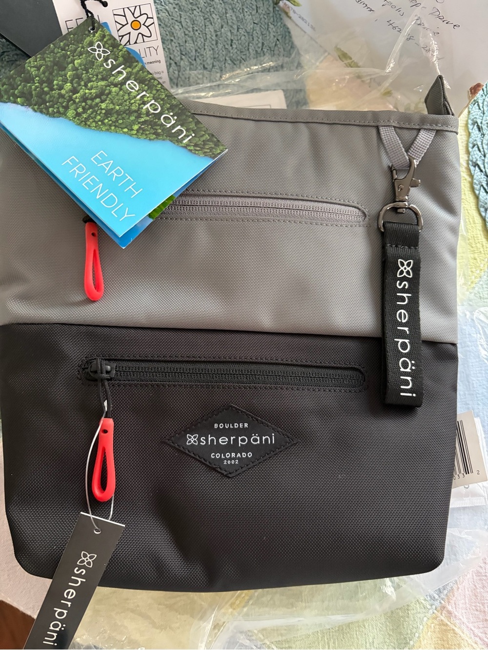 Sherpani Gray and Black Crossbody Messenger with Red Zipper Accents